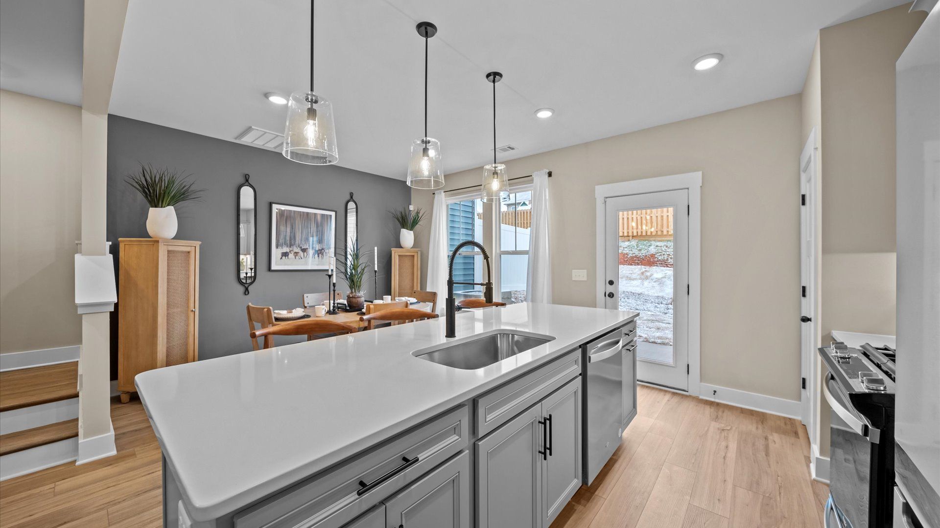 Exceptional culinary space with a striking 9-foot island and eye-catching pendant lights