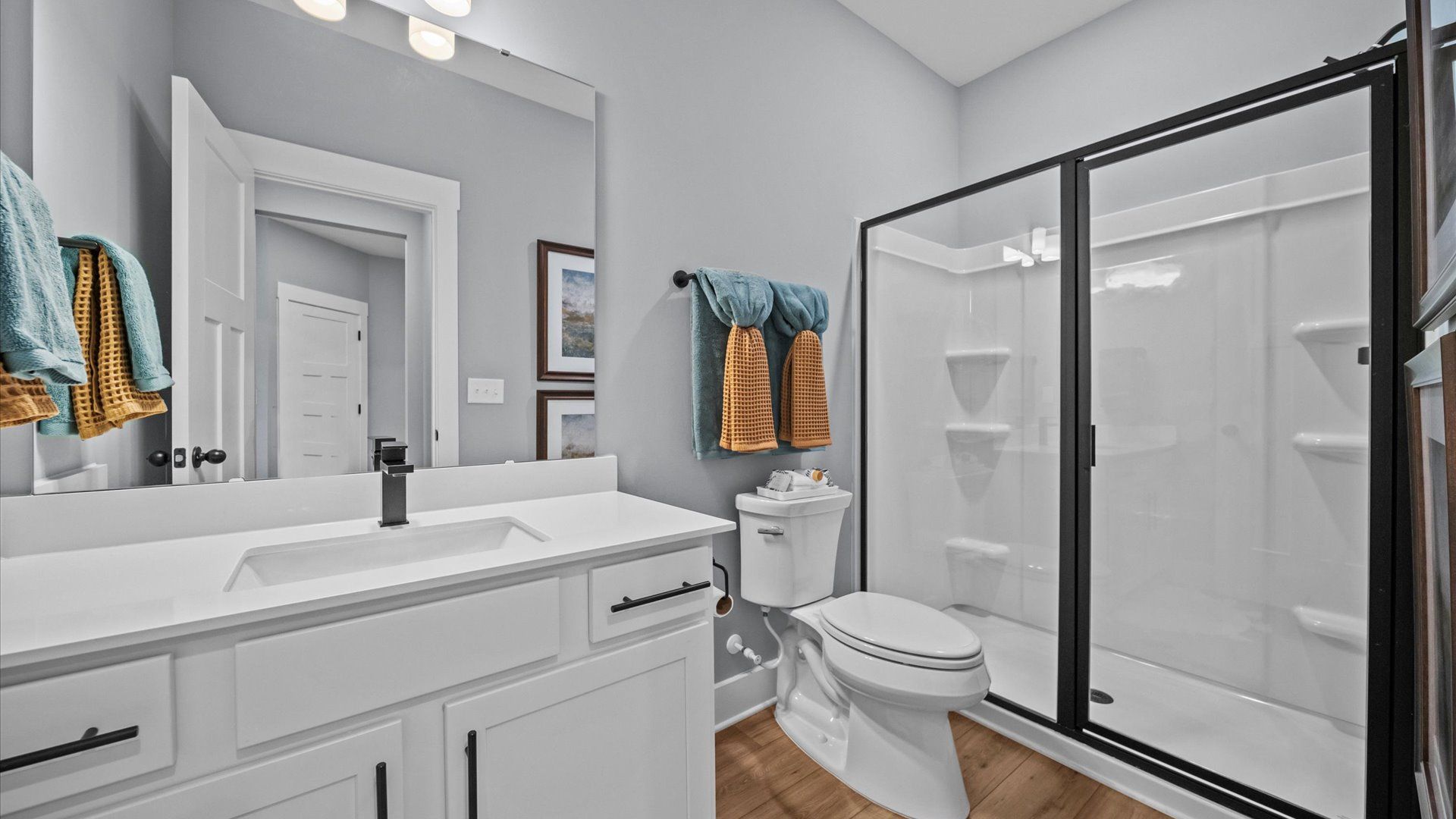 Spacious and modern primary bathroom with walk-in shower