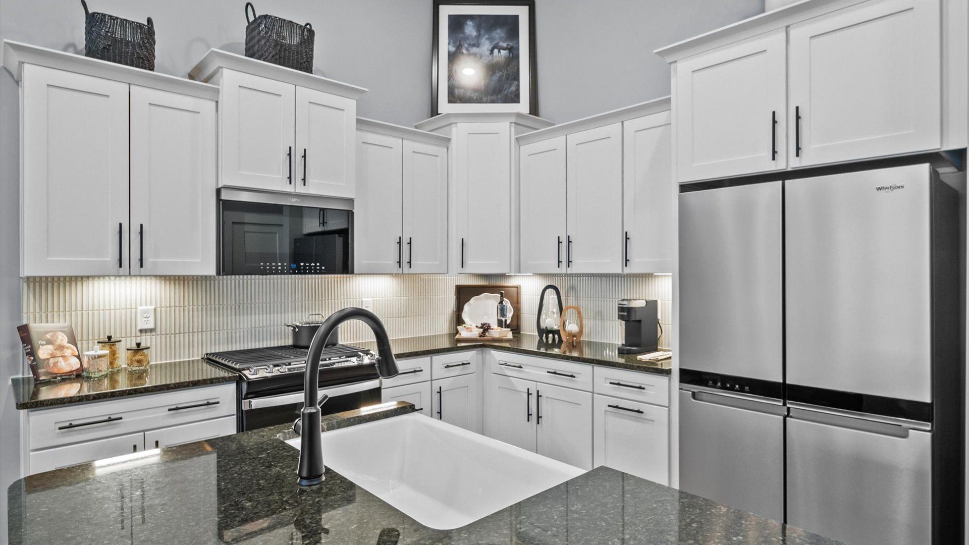 Modern kitchen with streamlined island for easy prep, storage, and gathering