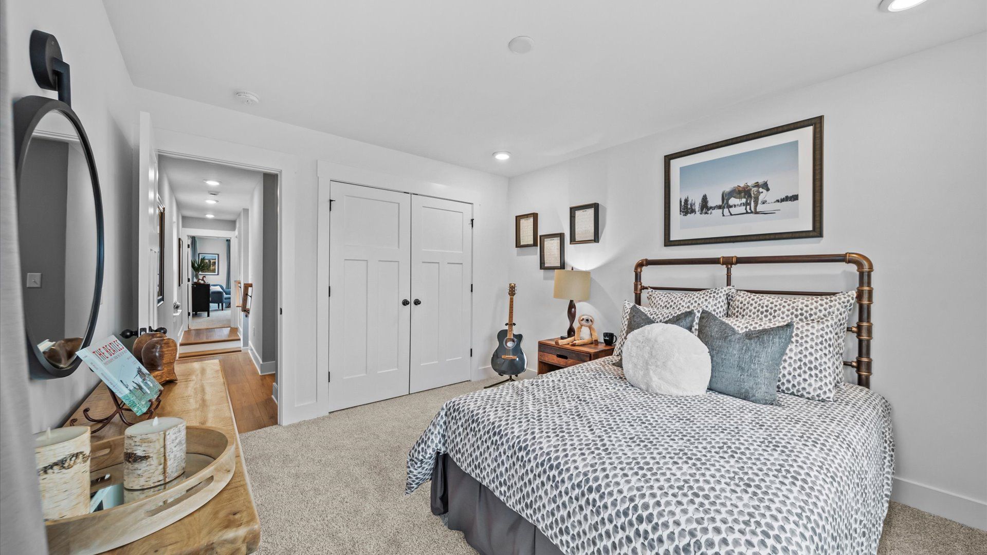 Highly functional bedroom with walk-in closet and tasteful carpet for a restful retreat