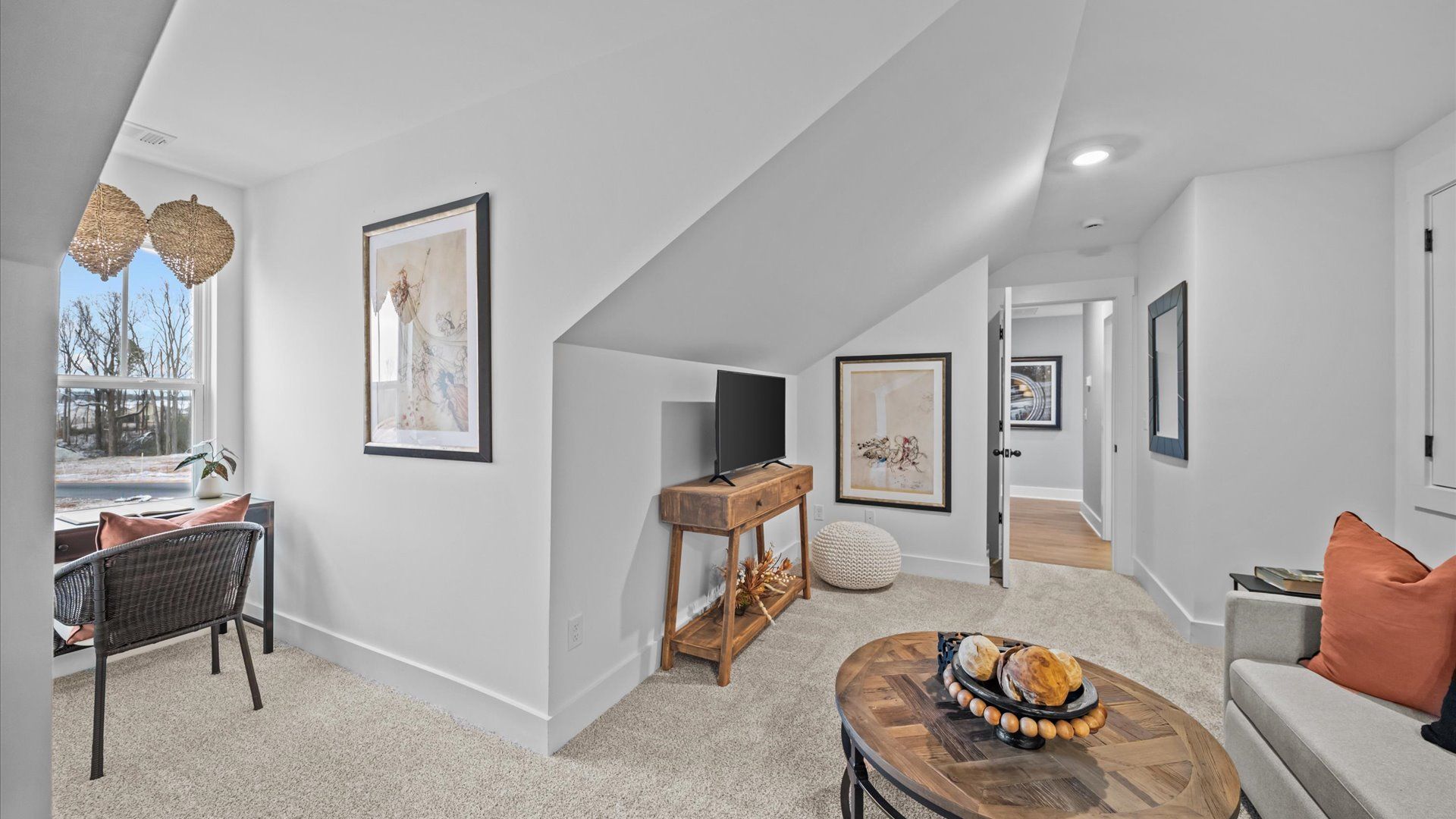 Vibrant loft with carpeted flooring and flexible space for work, play, or relaxing