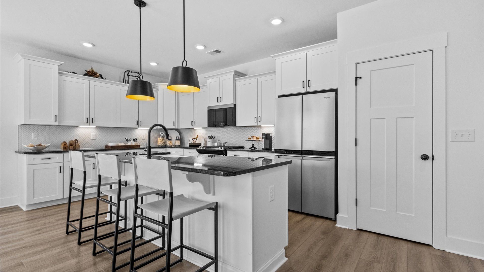 New two story home with modern kitchen & large island with room for counter stools at Pinebrook by DRB Homes in Woodruff, SC