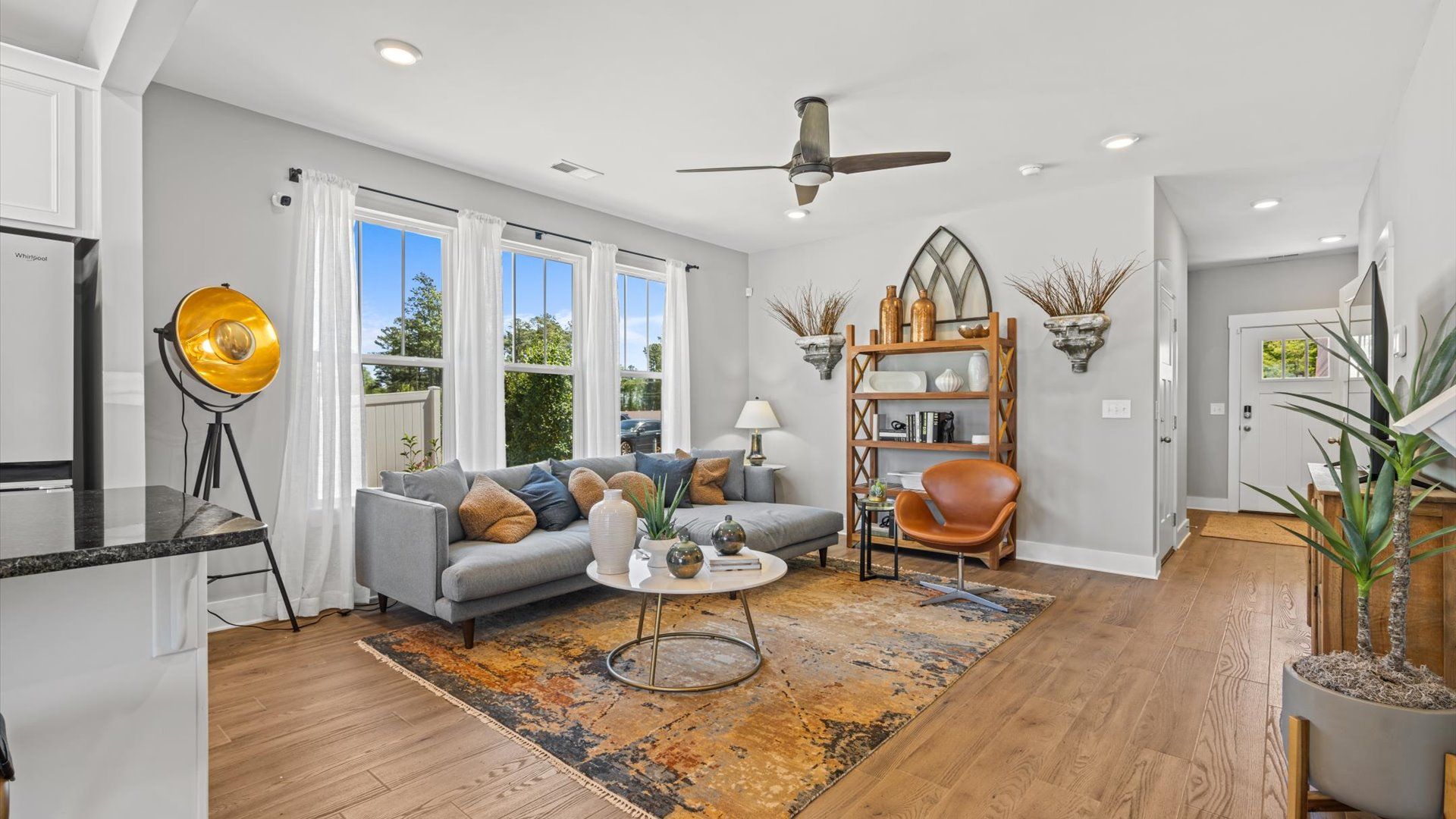 Colorfully decorated family room in two story townhome at Tyger Ridge by DRB Homes in Spartanburg, SC