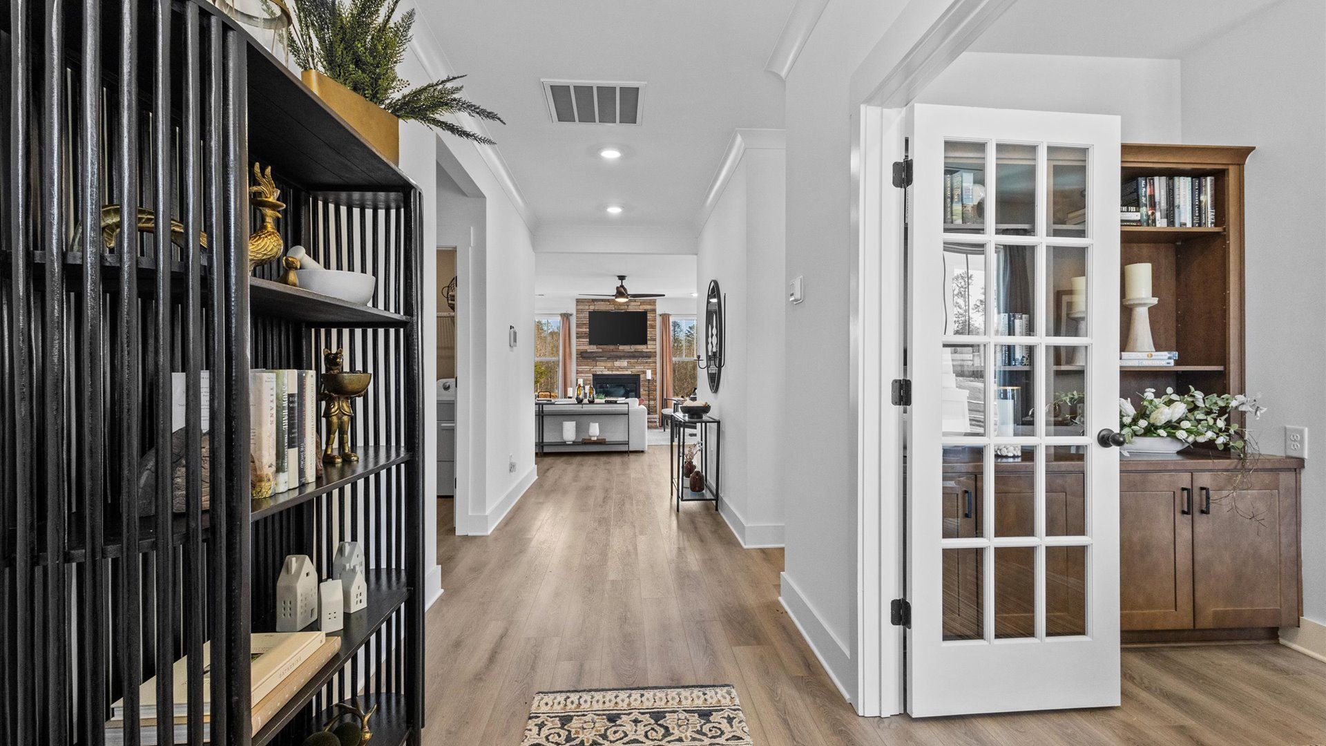 Vaulted ceiling entryway with hardwood flooring and white walls at Wells Crossing by DRB Homes in Seneca, SC