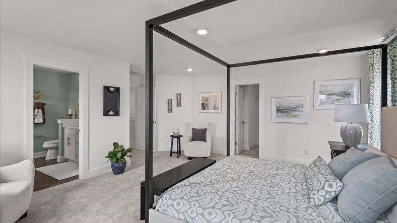 DRB Homes' Woodglen offering a serene primary suite with plush carpeted flooring in Piedmont, SC