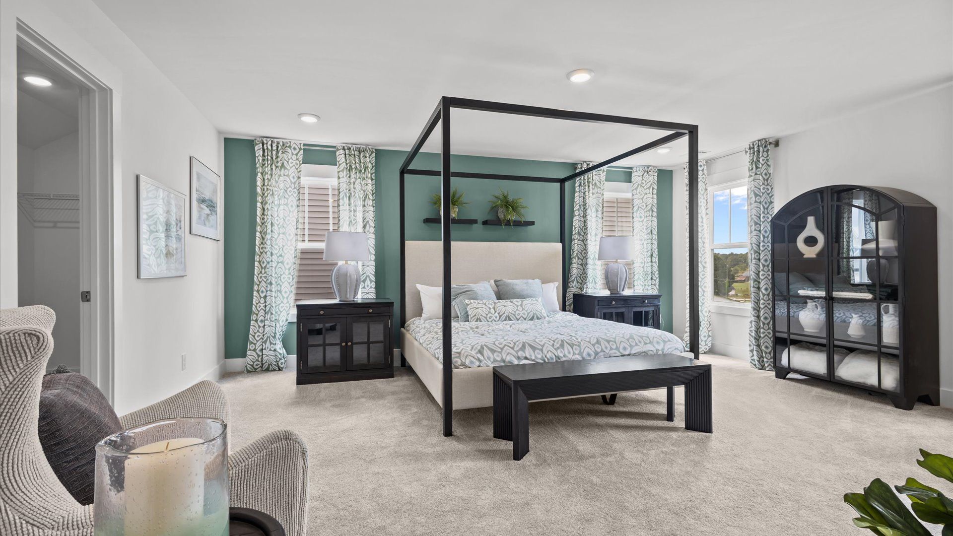 Cozy, relaxing primary suite with plush carpet and large windows to let the light in at Woodglen in Piedmont, SC