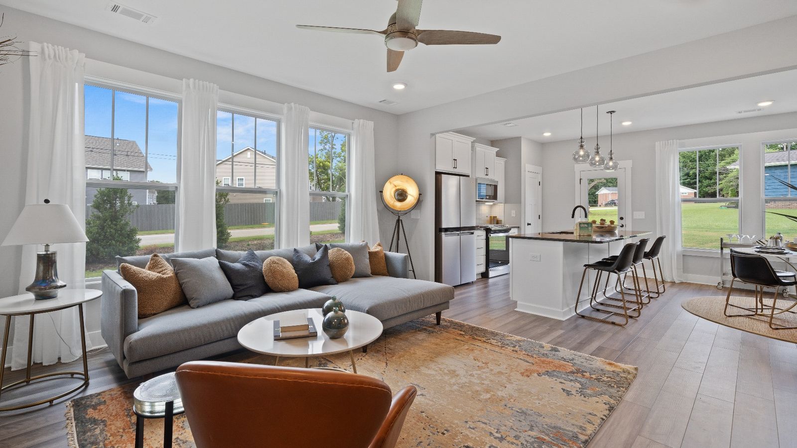 Spacious hardwood flooring family room with ceiling fan at Barton Hollow by DRB Homes in Fountain Inn, SC