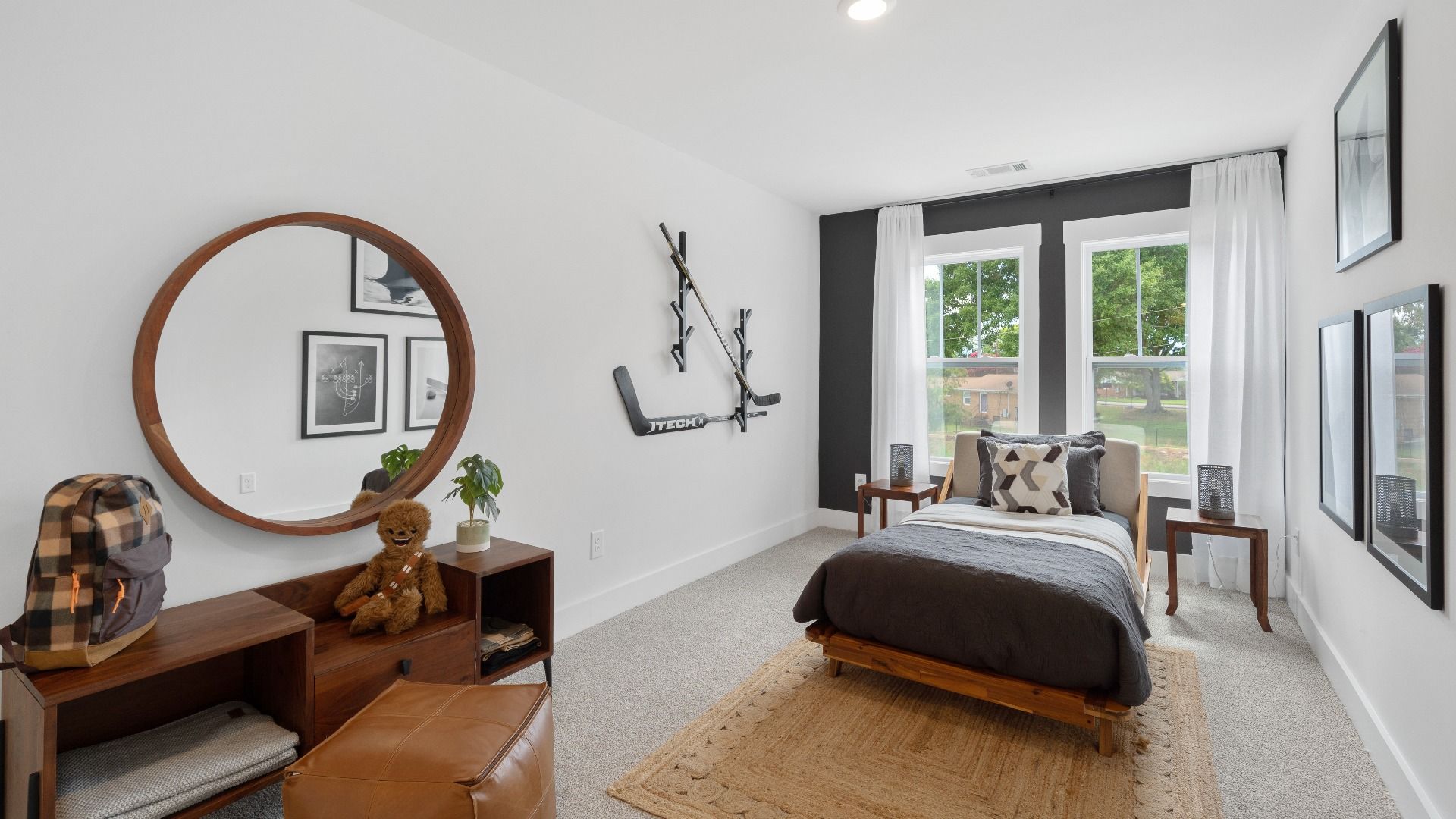 Cozy carpeted secondary bedroom with large windows at Barton Hollow by DRB Homes in Fountain Inn, SC