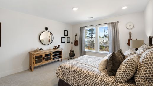 Very spacious secondary bedroom with carpeted flooring and large windows at Barton Hollow by DRB Homes in Fountain Inn, SC