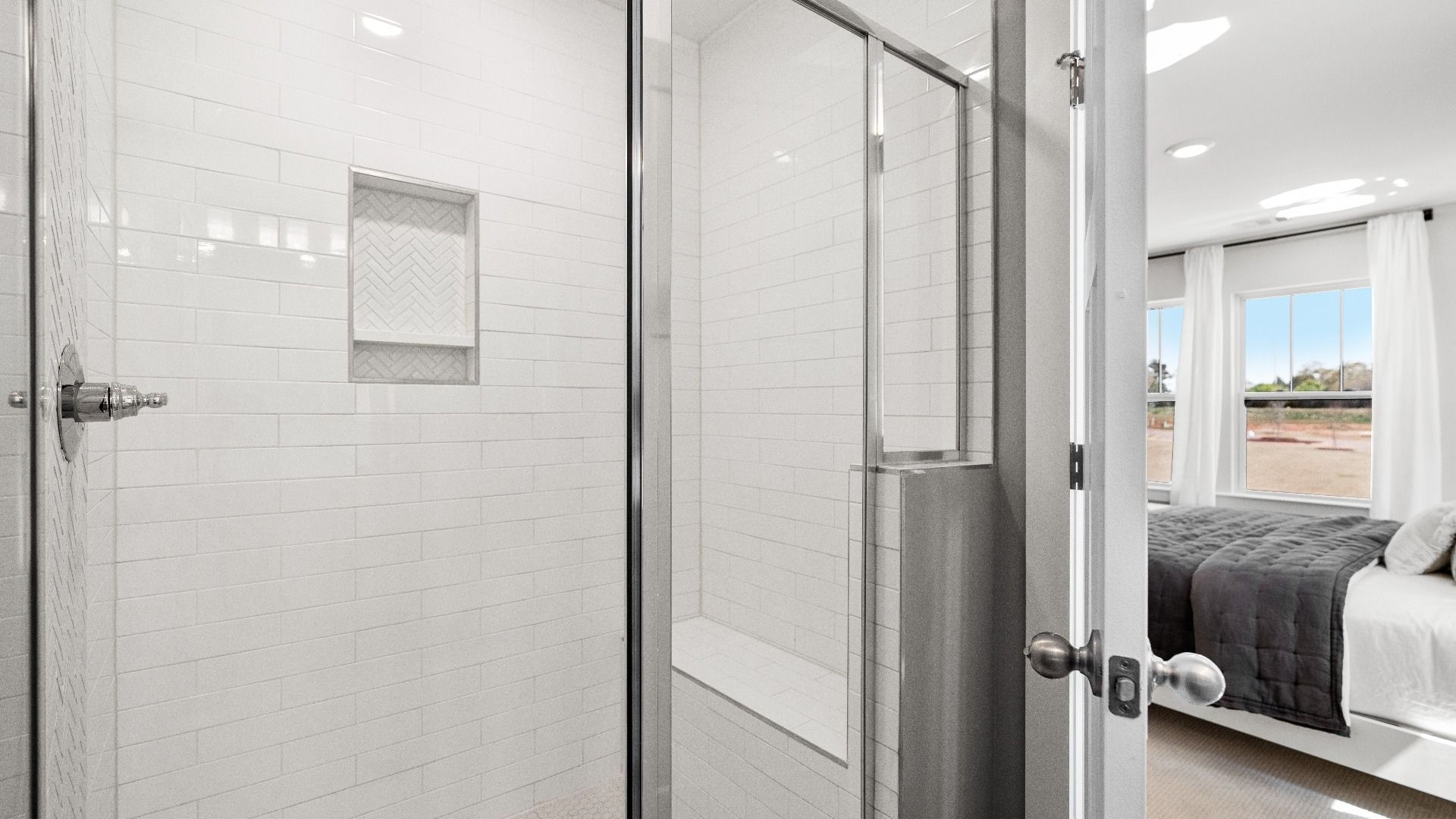 DRB Homes modern two story townhome at Clayton Crossing by DRB Homes in Arden, NC with bright white tiled shower