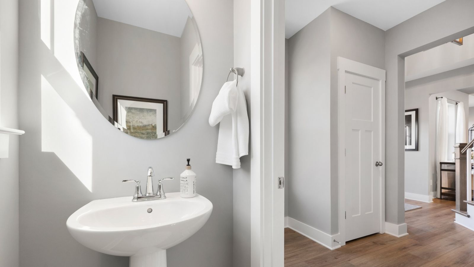 Polished nickel accented half bathroom with mirror