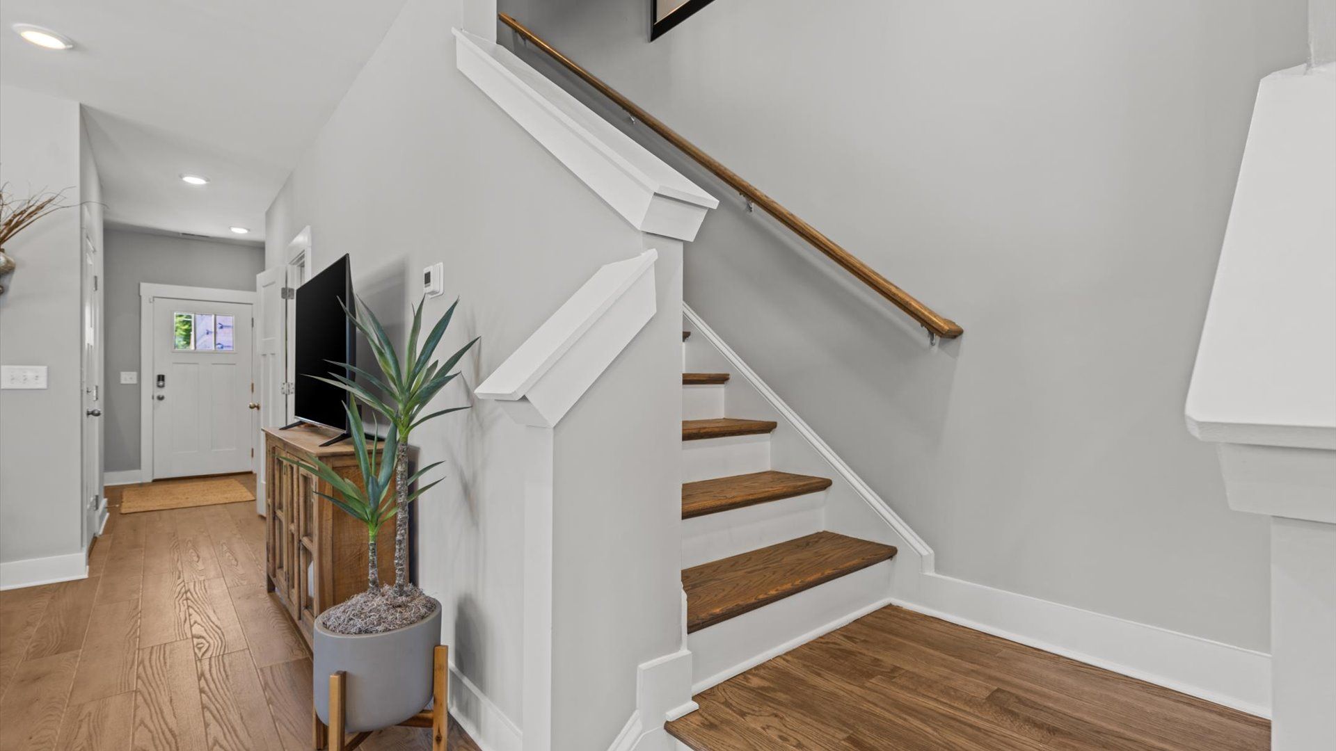 Luxe two story townhome with oak stairs at Clayton Crossing by DRB Homes in Arden, NC