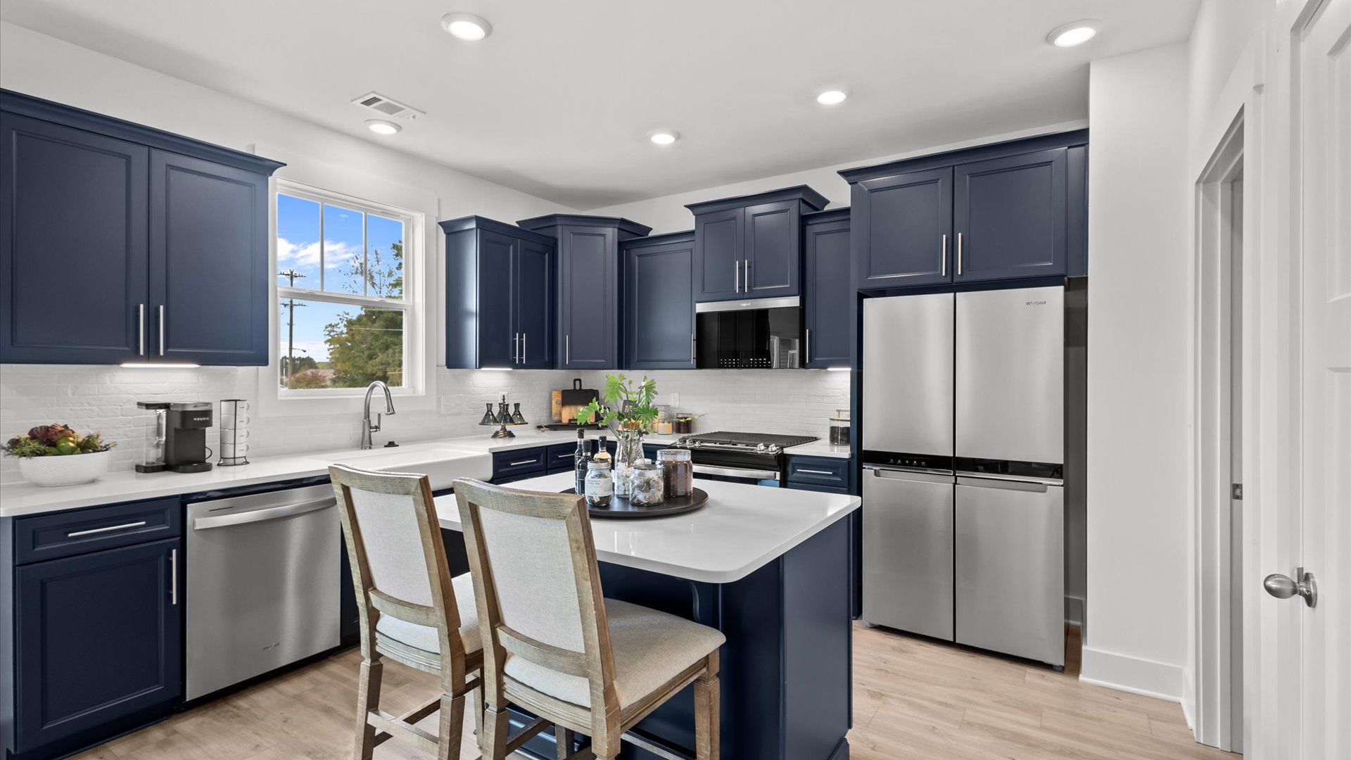 Modern kitchen with streamlined island for easy prep, storage, and gathering