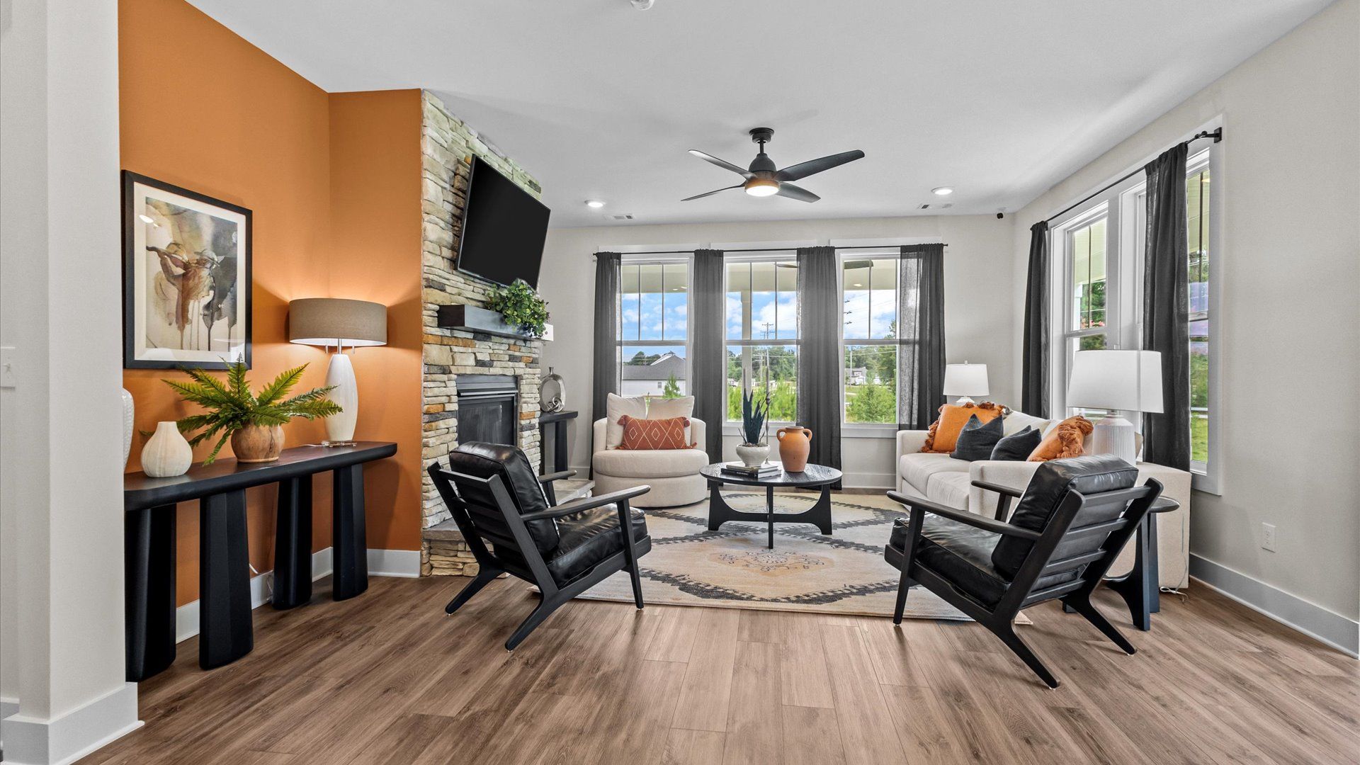 Vibrant and welcoming family room anchored by clean lines, tasteful materials, and abundant light