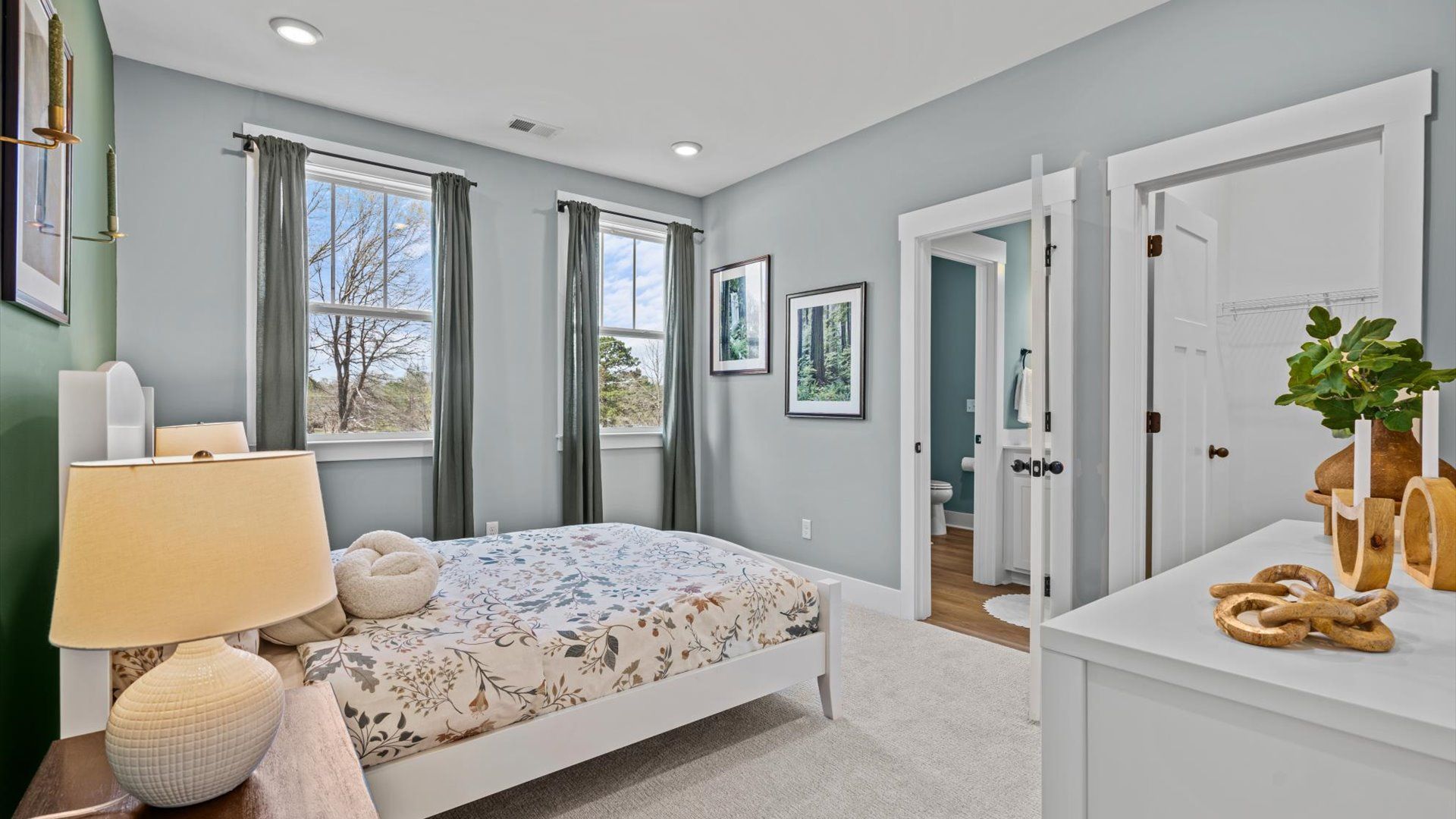Window adorned secondary bedroom with plush carpet at Pinebrook by DRB Homes in Woodruff, SC