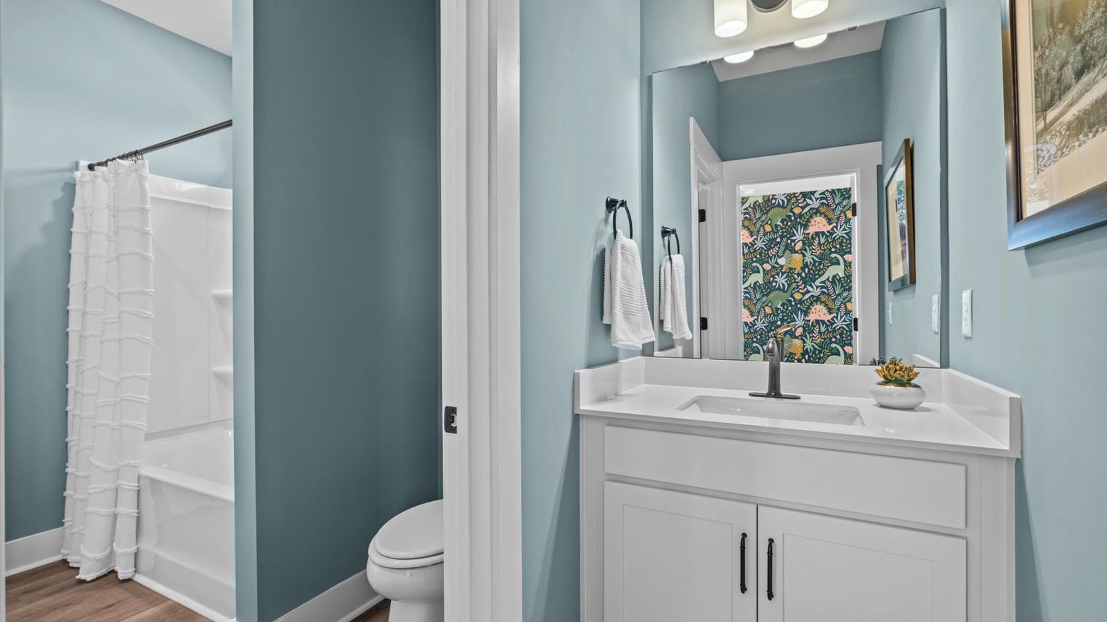 Separate vanities in secondary bathroom with shared shower at Pinebrook by DRB Homes in Woodruff, SC