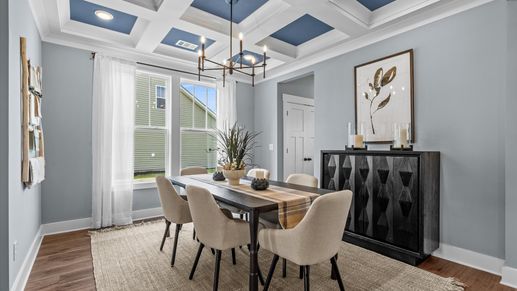 Calm, inviting dining room with coffered ceiling in two story home at Mulberry Estates by DRB Homes in Simpsonville, SC