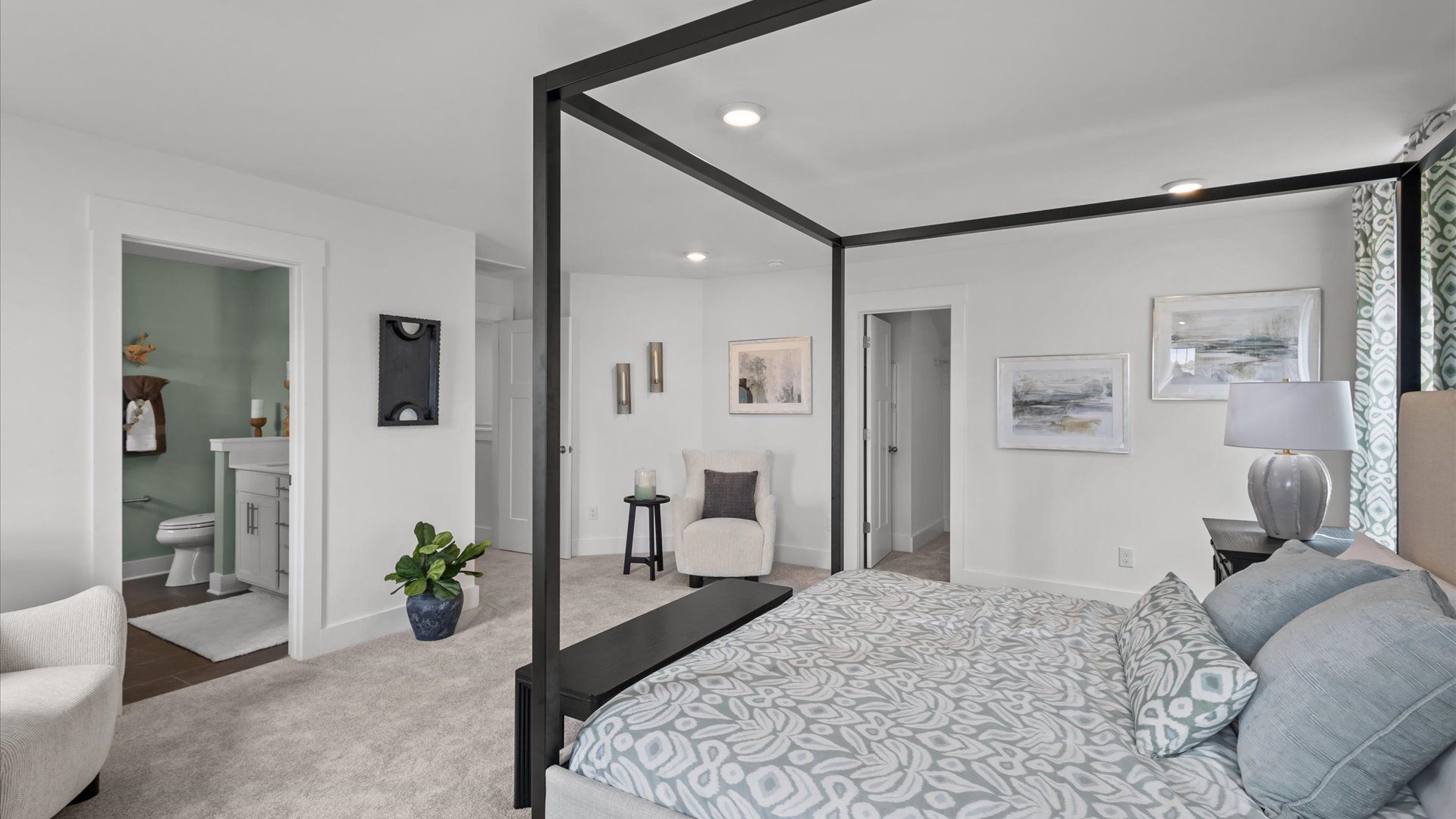 Serene primary suite with plush carpeted flooring in two story home at DRB Homes in Easley, SC