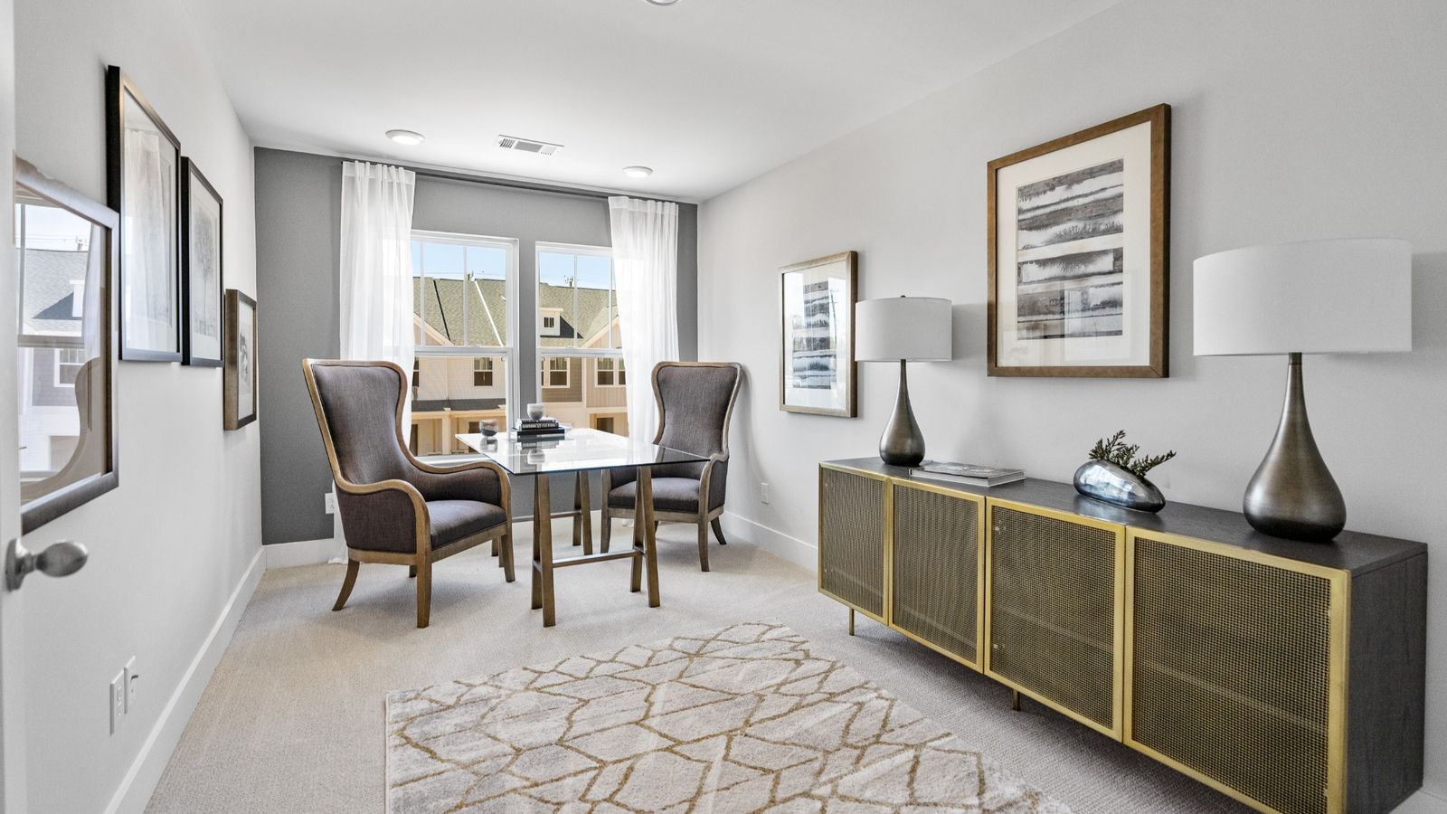 Carpeted secondary bedroom with two large windows in two story townhome at Ransdell Pointe by DRB Homes in Spartanburg, SC