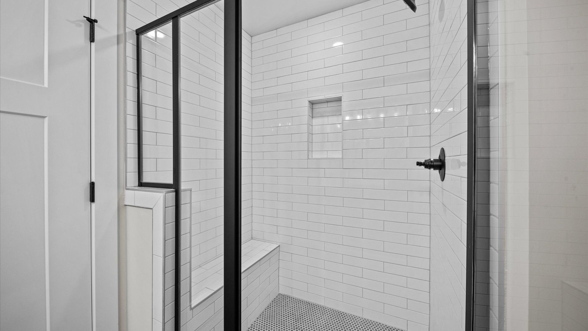 DRB Homes modern two story townhome at Hickory Heights near Downtown Greenville, SC with bright white tiled shower