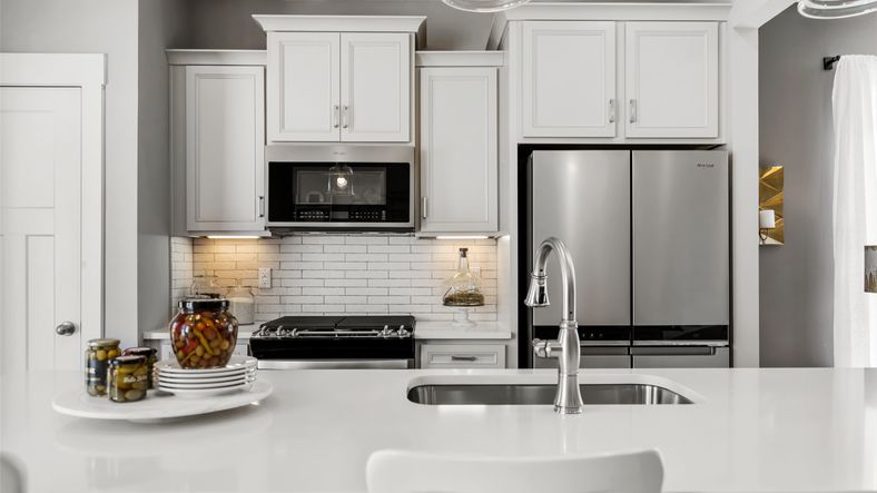 New two story townhome modern kitchen at Hickory Heights by DRB Homes near Downtown Greenville, SC