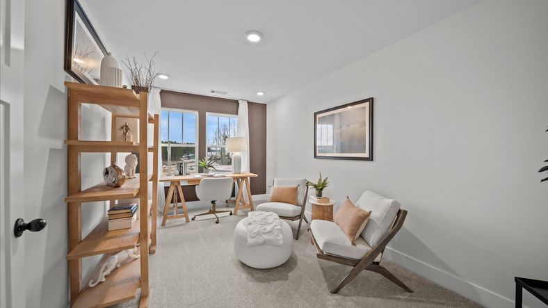 Carpeted secondary bedroom at Hickory Heights by DRB Homes in Downtown Greenville, SC