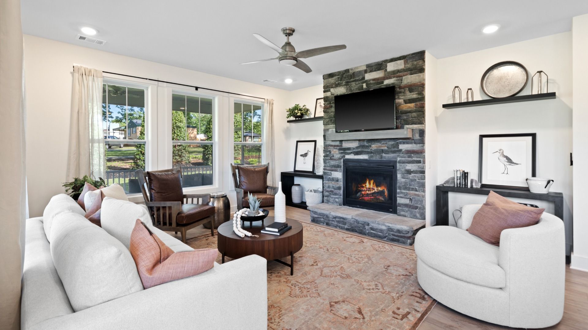Memorable moments begin in this elegant, open family room with hardwood flooring and refined finishes