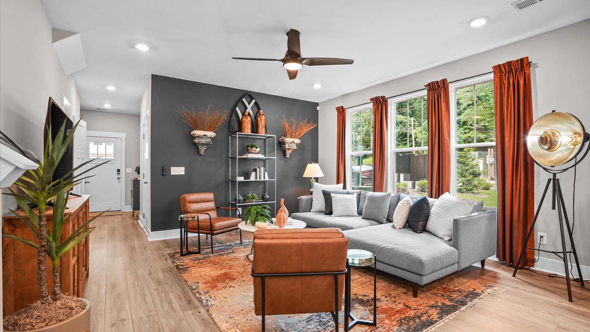 Colorfully decorated family room in two story townhome at Clayton Crossing by DRB Homes in Arden, NC