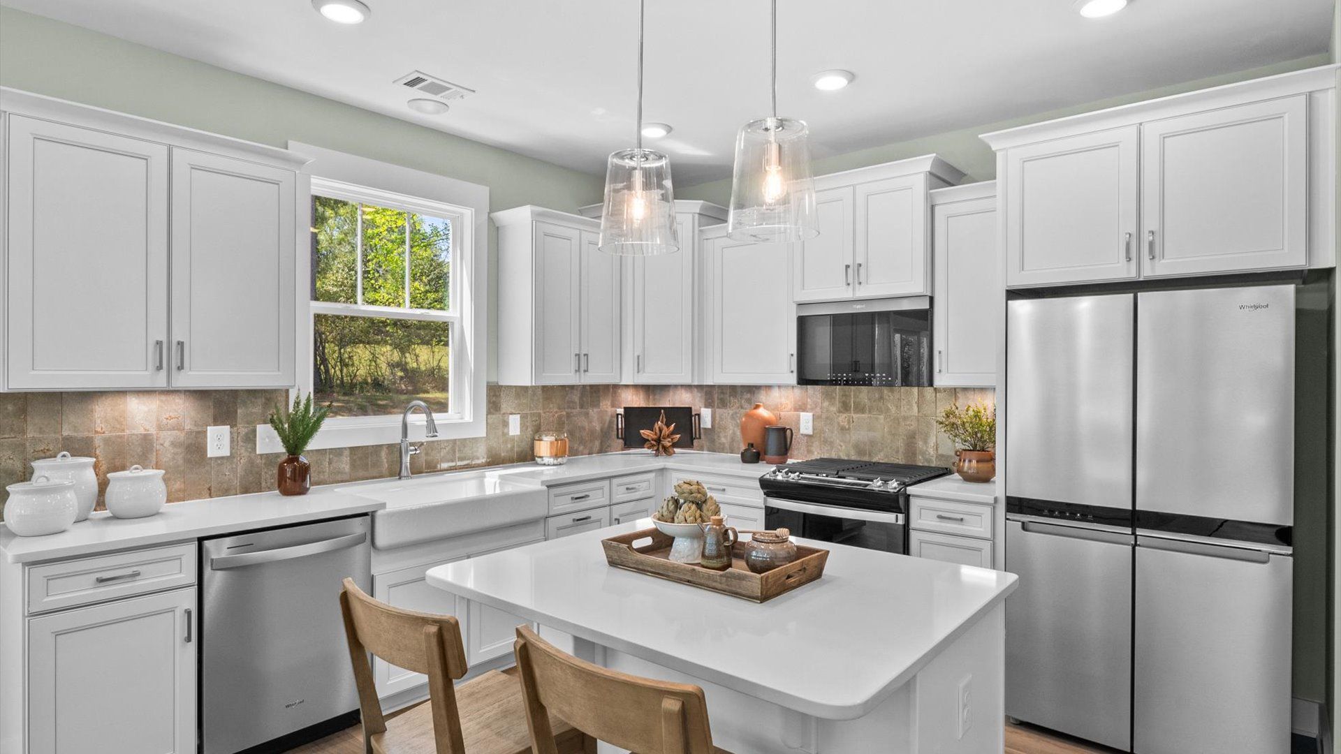 Memorable meals begin in this vibrant kitchen with pendant lighting and a thoughtfully designed island at Foxbank