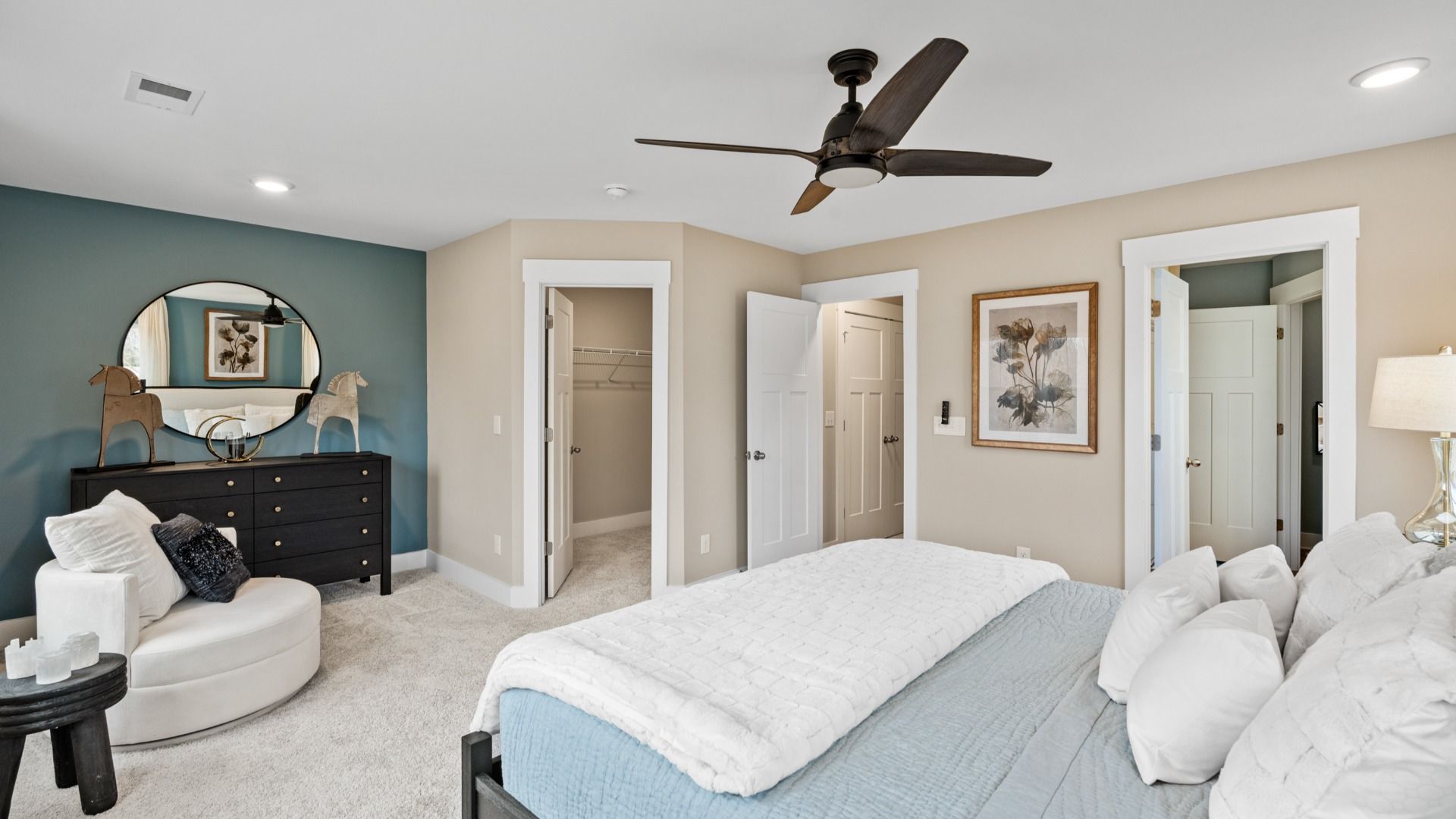 Plush carpeted primary suite with walk-in closet in two story townhome at Ransdell Pointe by DRB Homes in Spartanburg, SC