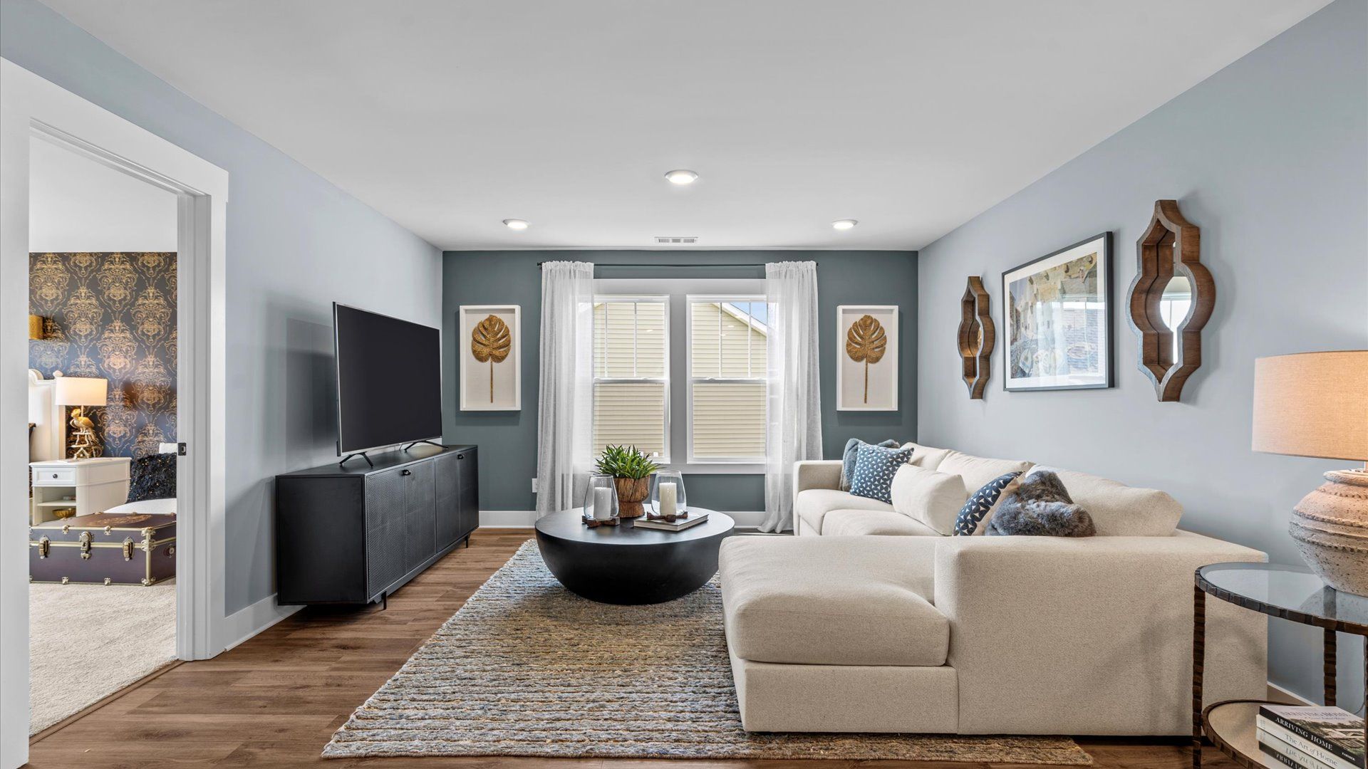 Hardwood flooring enhances the versatility of this elegant upper-level loft space