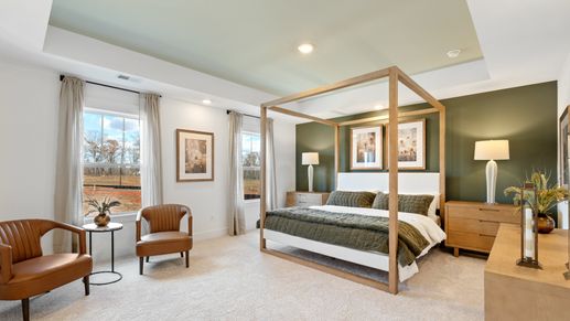 Vibrant natural light fills this exceptional primary suite with eye-catching details
