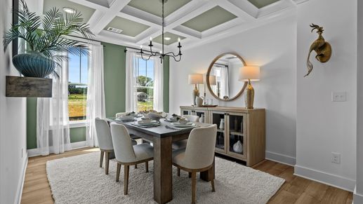 Memorable meals start beneath a coffered ceiling in this elegant and functional space