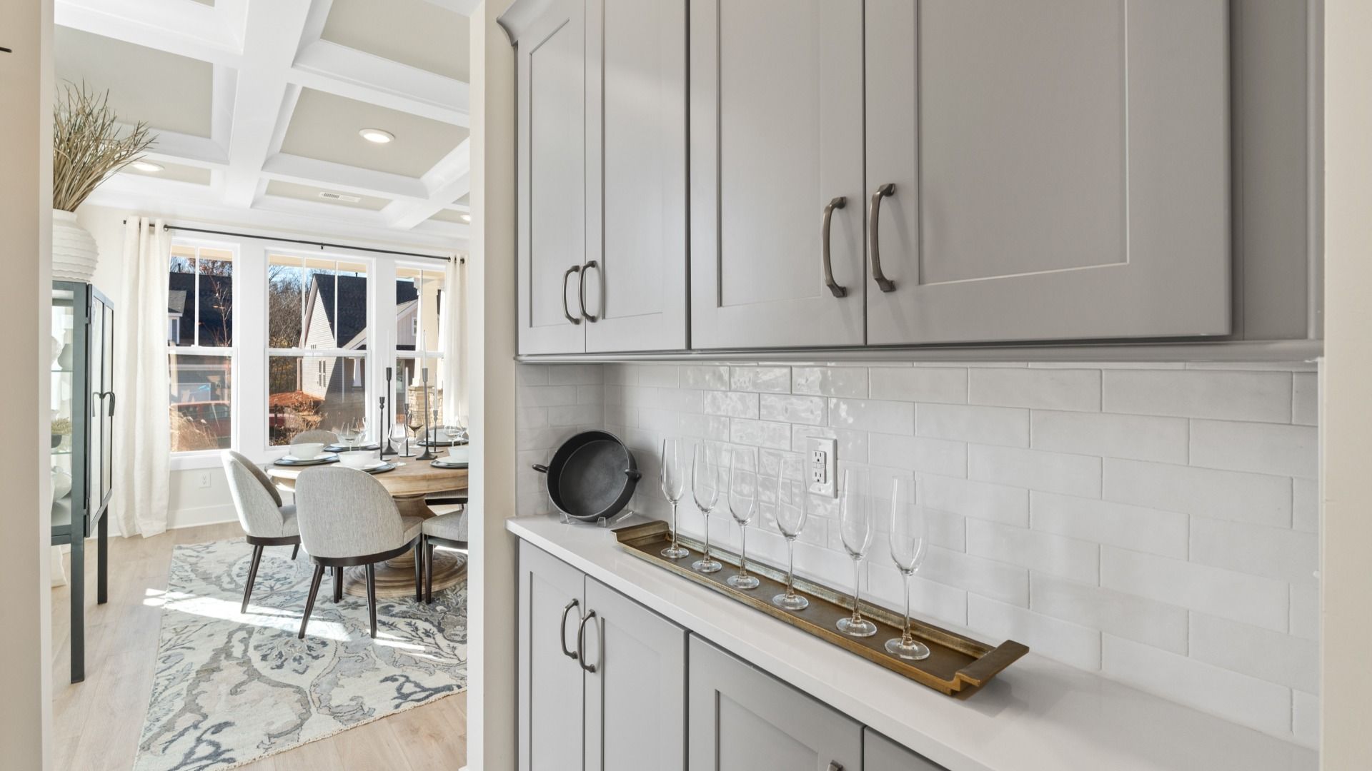First-class finishes and a thoughtful butler's pantry highlight this elegant kitchen space