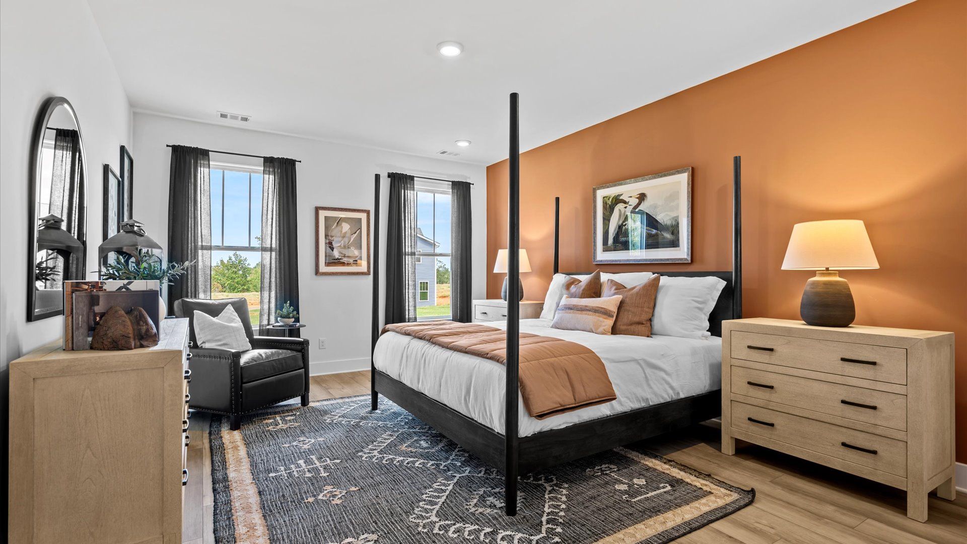 Vibrant natural light fills this exceptional primary suite with eye-catching details