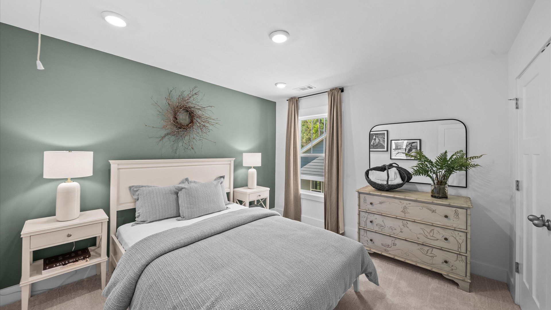 Memorable space with walk-in closet, soft carpeting, and striking natural light from large windows