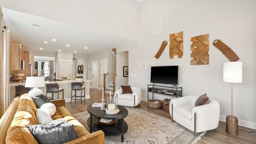 First-class living space featuring expansive ceilings, elegant design, and open sightlines to the kitchen