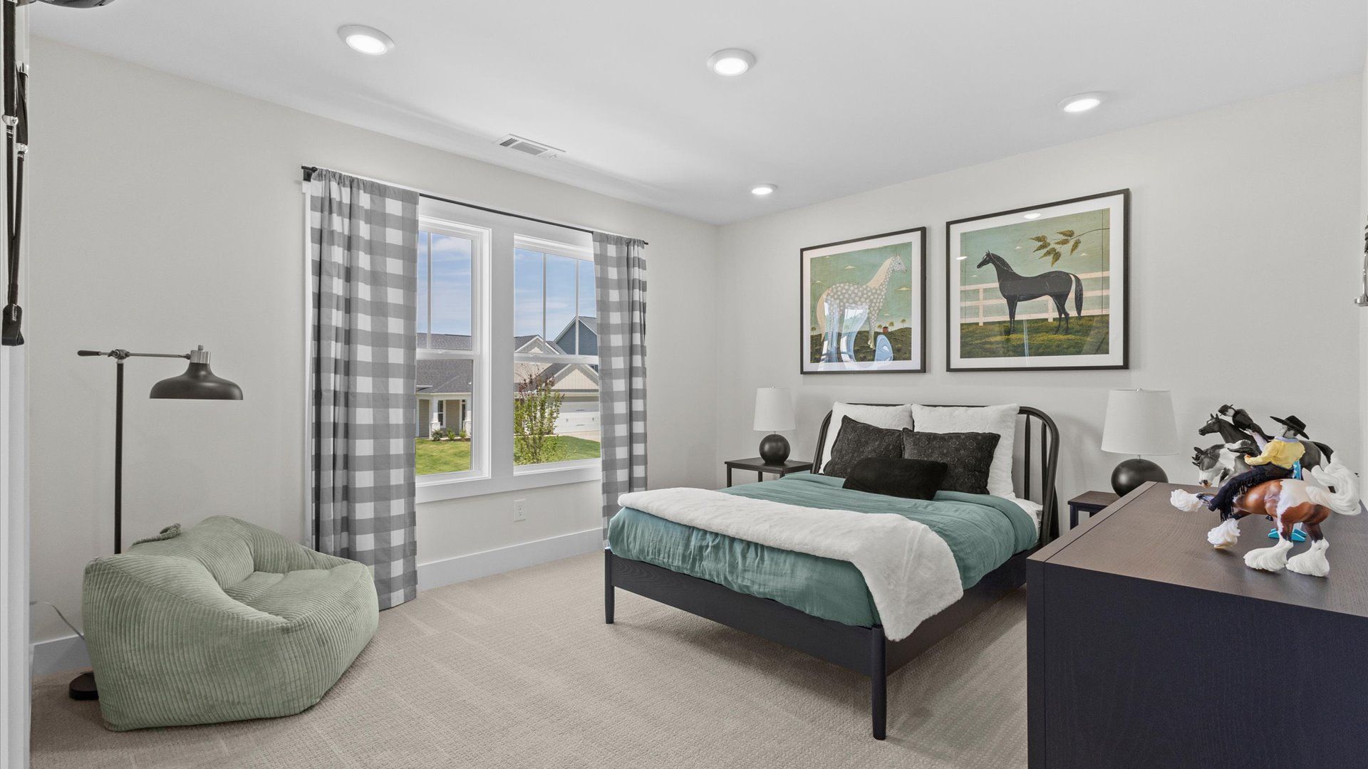 Vibrant and restful bedroom with oversized windows, refined detail, and a warm, welcoming atmosphere