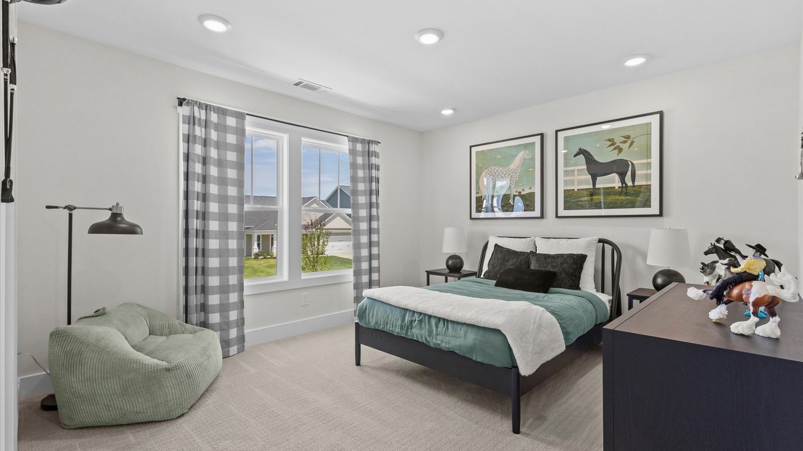 Vibrant and restful bedroom with oversized windows, refined detail, and a warm, welcoming atmosphere