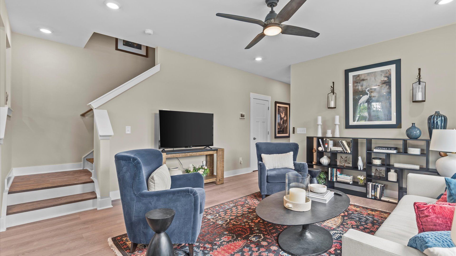 Hardwood flooring family room with ceiling fan in two story townhome at Ransdell Pointe by DRB Homes in Spartanburg, SC