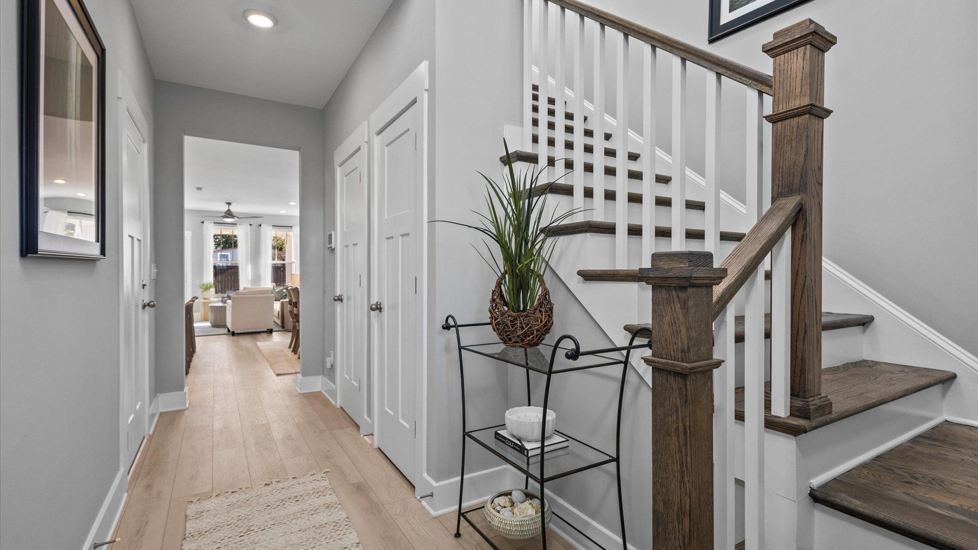 Mint home plan foyer and entry stairs with open railing