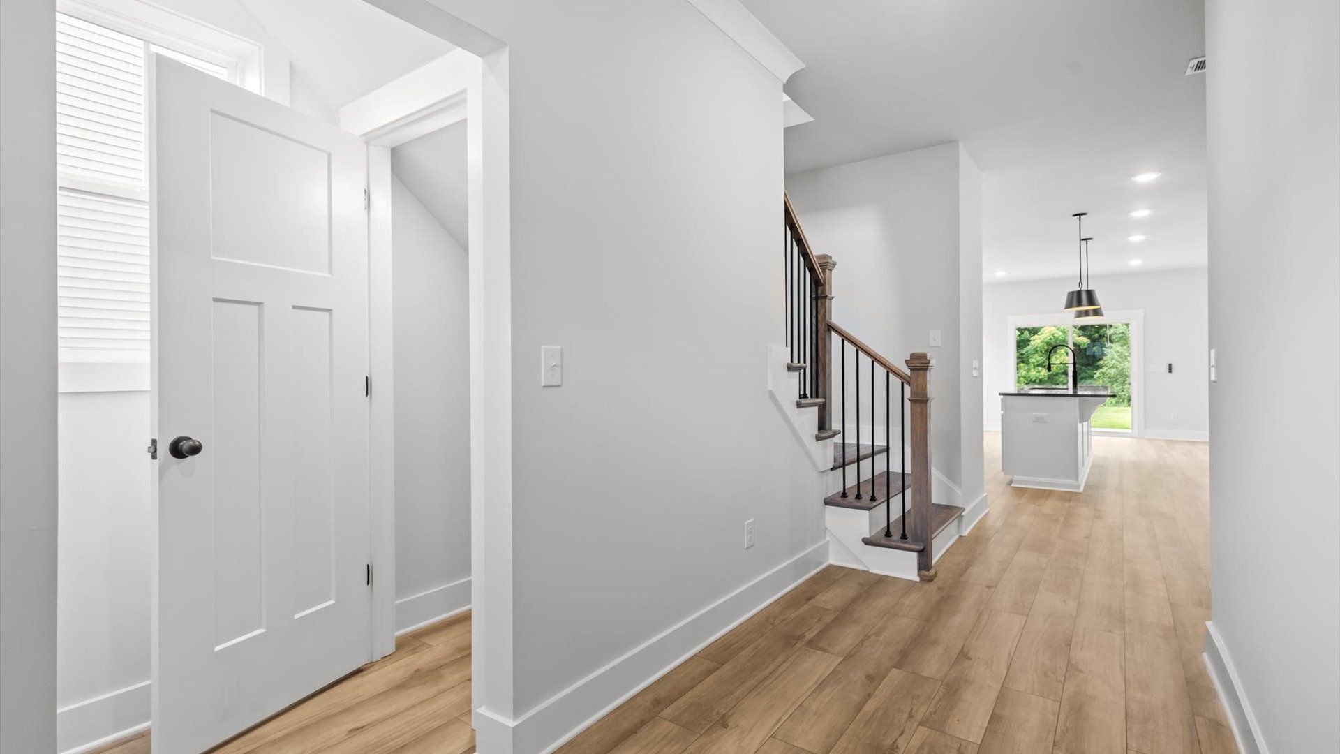 Neroli home plan open entryway and powder bathroom