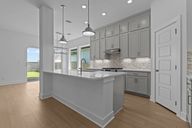 Adelton por David Weekley Homes en Austin Texas
