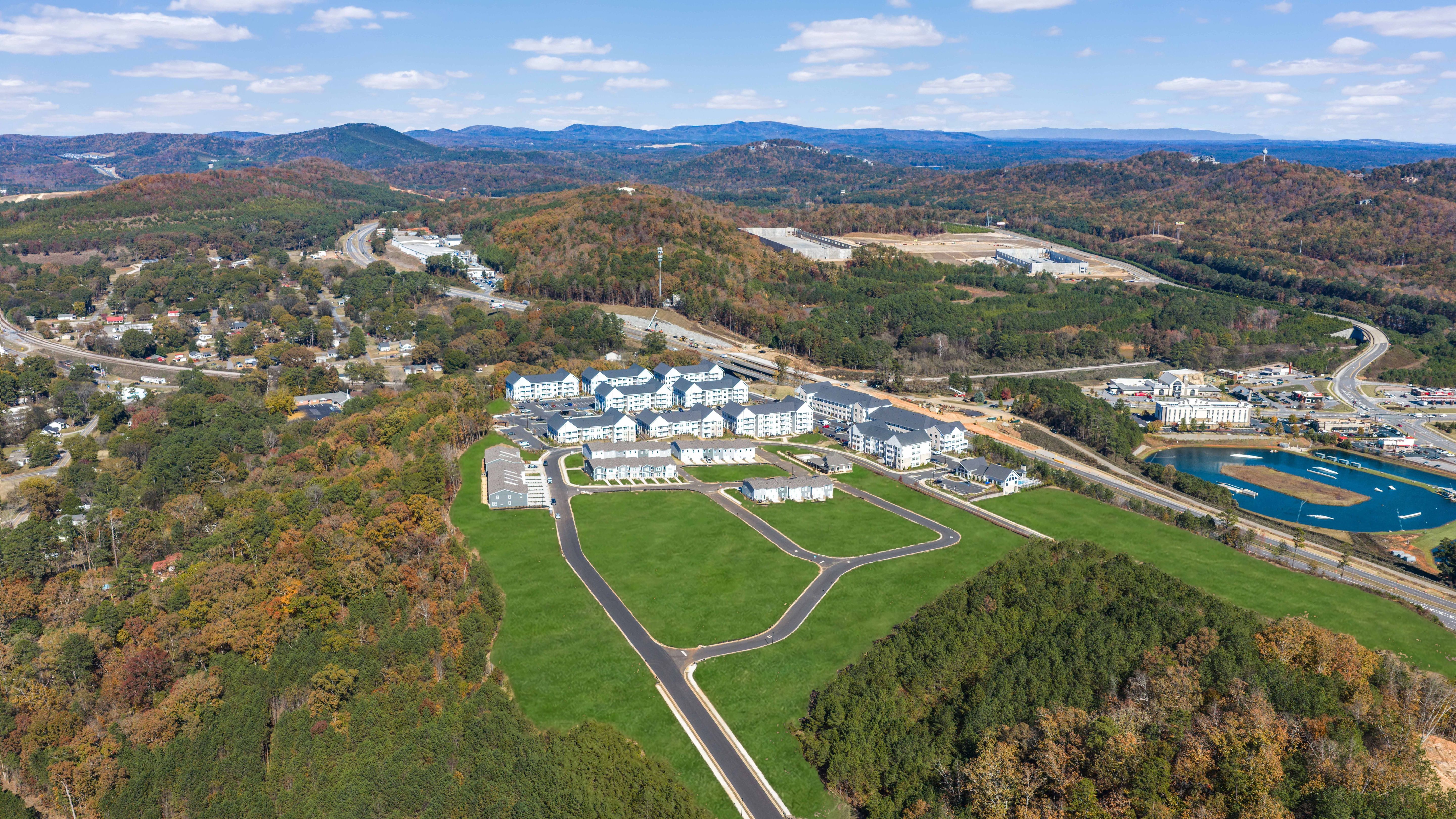 Aerial of Stegall Village with mountains and sports complex