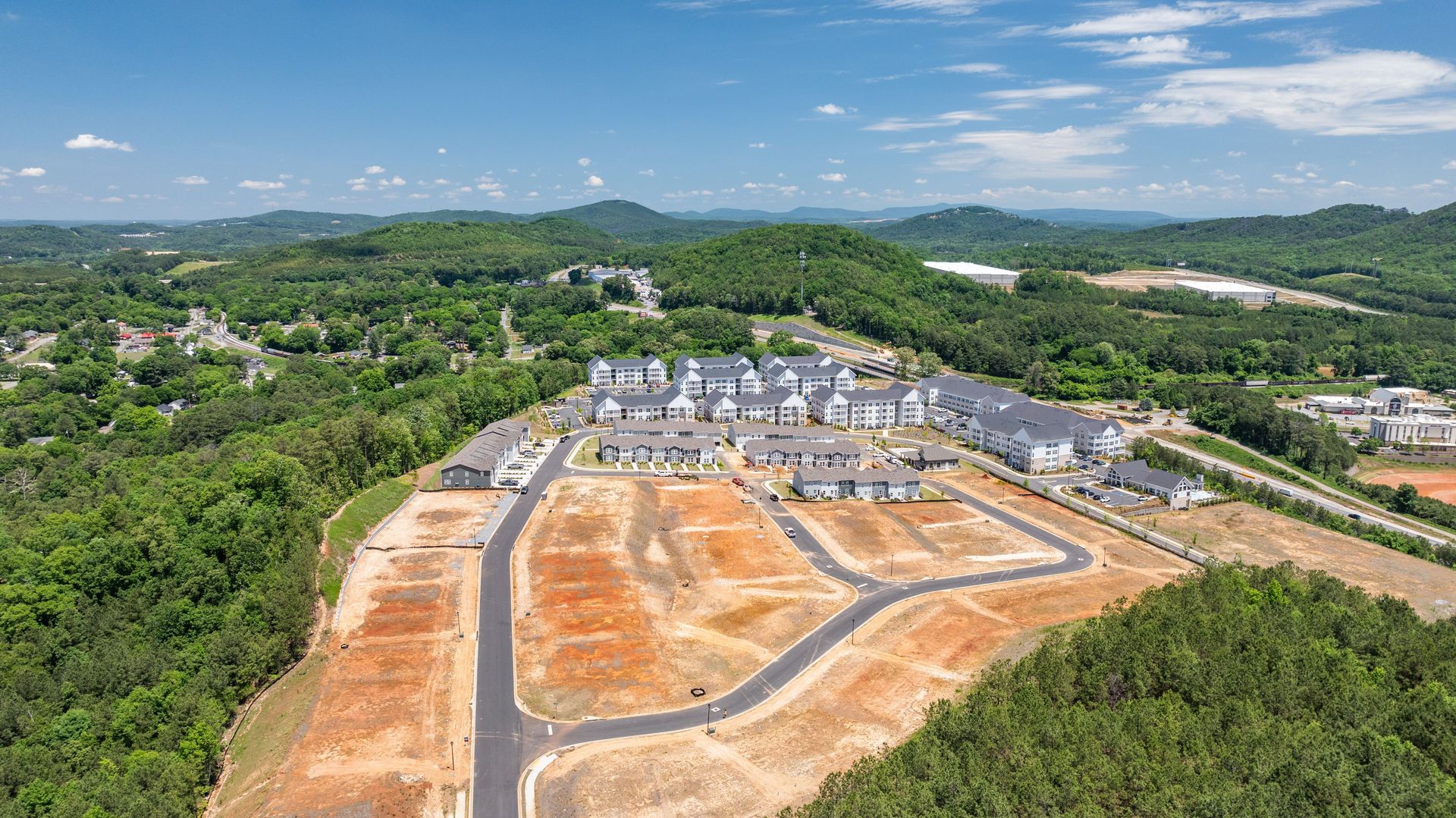Aerial of Stegall Village with mountains and sports complex