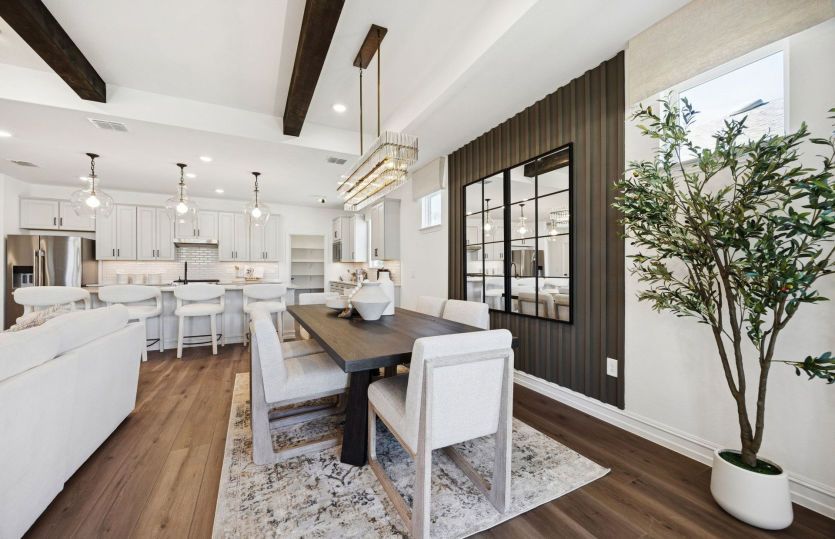 Dining area with view of kitchen and main living areas