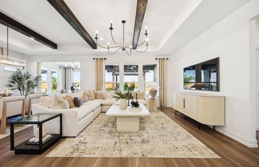 Open living area with large windows and optional beams