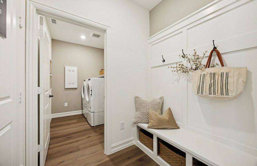 Spacious mud bench at entry from garage