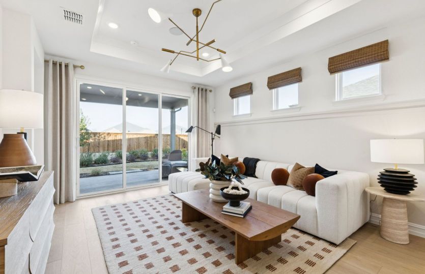 Spacious gathering room with tray ceiling