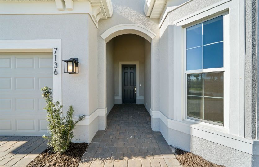 Inviting Prestige Exterior with Impact Glass